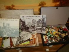 A quantity of costume jewellery and Lincoln related brochures.