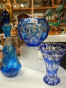 Three items of blue overlaid glass.