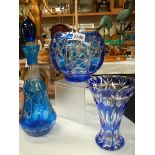 Three items of blue overlaid glass.