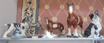 A mixed lot of dog and horse figures.