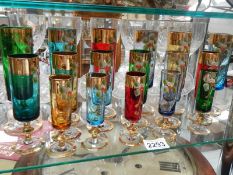 17 hand decorated coloured glasses.