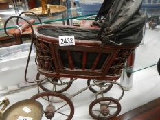 A vintage dolls pram. COLLECT ONLY.