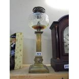 A Victorian brass oil lamp base with glass font. COLLECT ONLY.