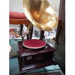 A 20th century horn gramaphone with brass horn. COLLECT ONLY.