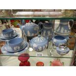 A shelf of Wedgwood Jasper Ware.