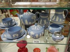 A shelf of Wedgwood Jasper Ware.