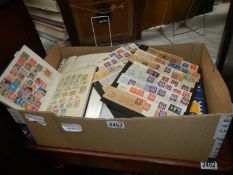 A box of stamps and stamp albums.