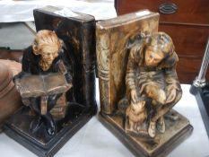 A pair of old figural book ends.