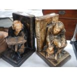 A pair of old figural book ends.