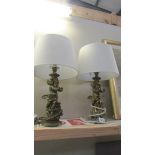 A pair of gilded cherub table lamps with shades. COLLECT ONLY.