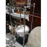 A chrome umbrella stand on cast base, COLLECT ONLY.