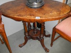 An oval mahogany inlaid table with birdcage base. COLLECT ONLY.
