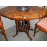 An oval mahogany inlaid table with birdcage base. COLLECT ONLY.