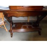 An oak hall table with stretcher base. COLLECT ONLY.