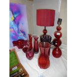 A mixed lot of red glass including a pair of table lamps. COLLECT ONLY.