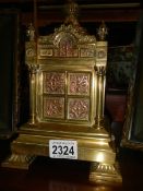 A Victorian brass centrepiece.