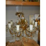 A late 20th century brass and glass chandelier, COLLECT ONLY.
