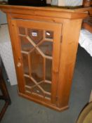 A Victorian style astragal glazed pine corner cupboard. COLLECT ONLY.