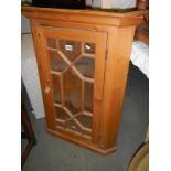 A Victorian style astragal glazed pine corner cupboard. COLLECT ONLY.