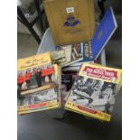 A box of various Royalty books and magazines.