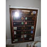 A framed 'The Millenium Collection' 100 years of coins and stamps.