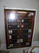 A framed 'The Millenium Collection' 100 years of coins and stamps.