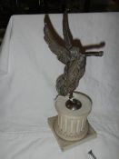 A metal figure on a bisque base (possibly Elkington), damage to horn.