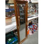 A long heavy gilt framed bevel edged mirror. COLLECT ONLY.