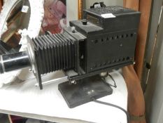 An early 20th century Ensign Optiscope No.6 magic lantern projector.