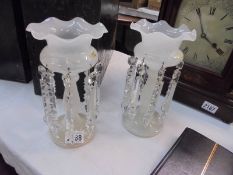 A pair of opaque glass lustres,