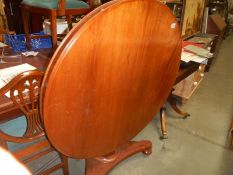 A Victorian mahogany circular tip top table in good condition, COLLECT ONLY.