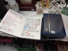 Three albums of assorted stamps.