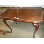 A mahogany fold over table. COLLECT ONLY.
