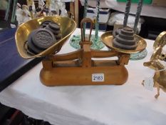 A set of Avery scales and a quantity of assorted weights.