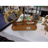 A set of Avery scales and a quantity of assorted weights.