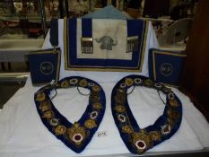 Two Masonic collars, a Masonic apron and a pair of cuffs.