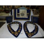 Two Masonic collars, a Masonic apron and a pair of cuffs.