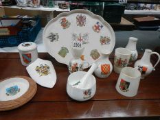 Eleven pieces of Goss crested china.