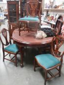 An excellent mahogany wind out dining table with 2 leaves and 6 chairs, COLLECT ONLY.