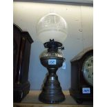 A brass oil lamp with later etched glass shade. COLLECT ONLY.