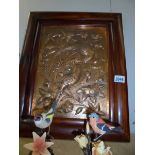 A framed copper plaque depicting birds.