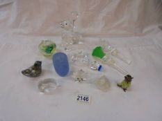 A mixed lot of glass paperweights, stoppers etc.,