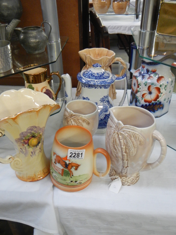 A mixed lot of jugs including Beswick, Carlton ware etc.,