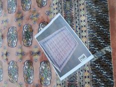 A pink patterned rug.