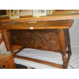 A heavy oak carved front coffer/chest with vine/grape decoration, COLLECT ONLY.