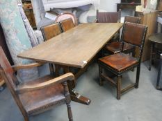 A good quality mid 20th century solid oak dining table with 2 carvers and 4 dining chairs, COLLECT