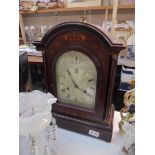 A mahogany inlaid bracket clock.