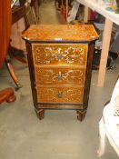 An unusual late 20th century painted chest of drawers (chips to glass top) COLLECT ONLY.