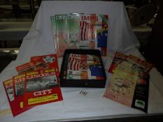 A quantity of Lincoln City football programmes.
