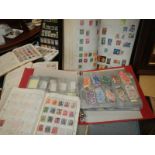 A large lot of stamp albums and loose stamps.